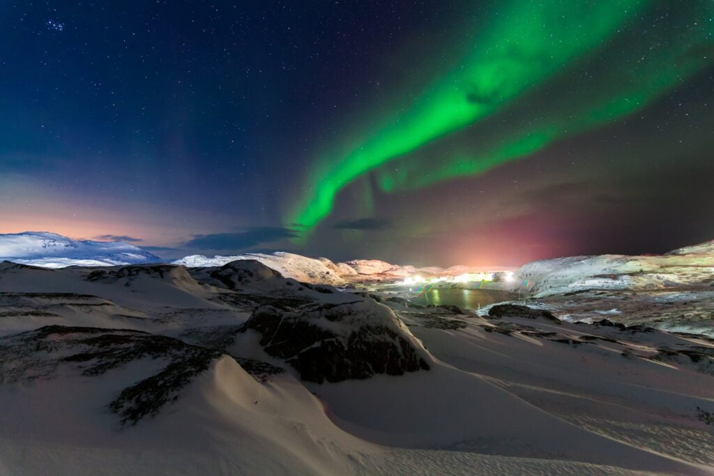 Northern lights above the fjord in Norway